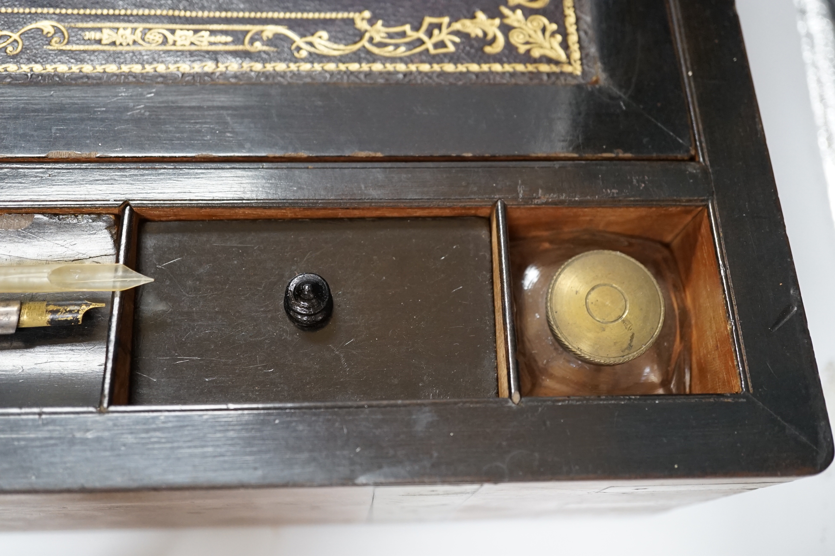 A Victorian walnut brass bound writing slope, 50cm wide x 25cm deep x 18cm high